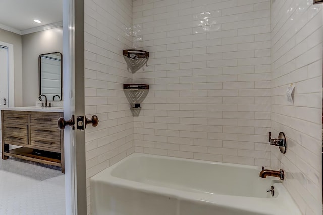 bathroom with ornamental molding, tub / shower combination, and vanity