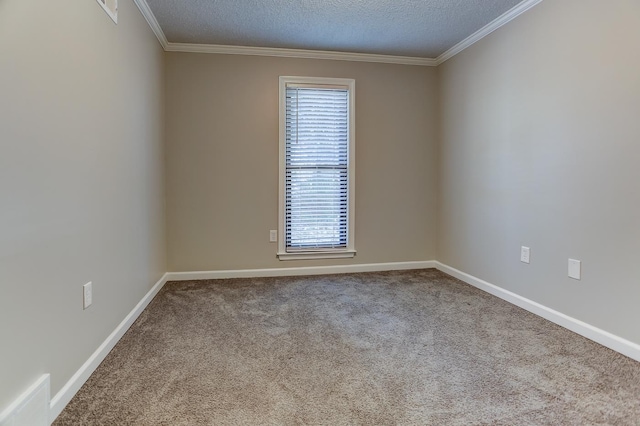 carpeted empty room with a textured ceiling, ornamental molding, and plenty of natural light