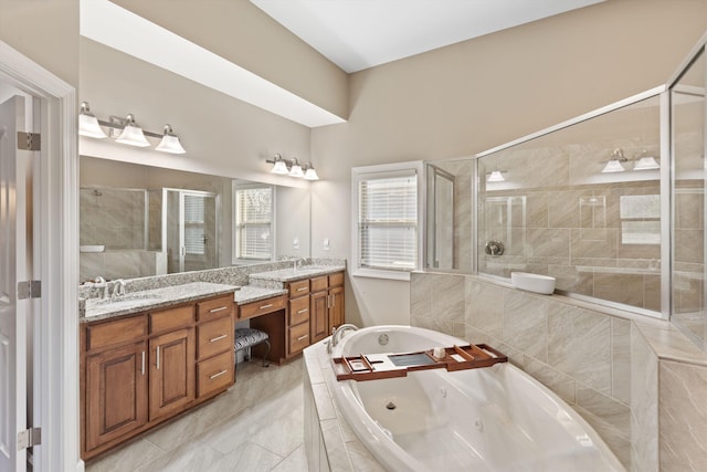 bathroom featuring vanity and shower with separate bathtub