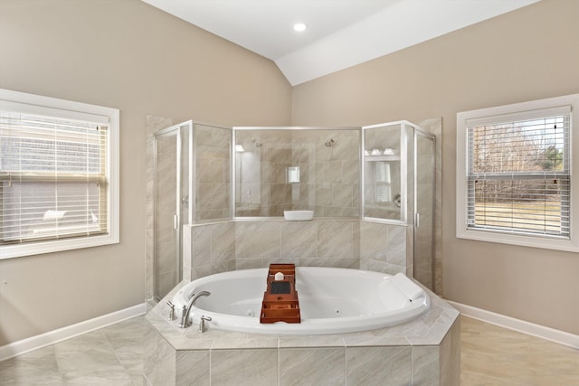 bathroom featuring lofted ceiling and separate shower and tub