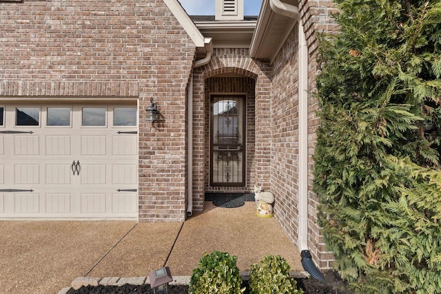 view of exterior entry featuring a garage