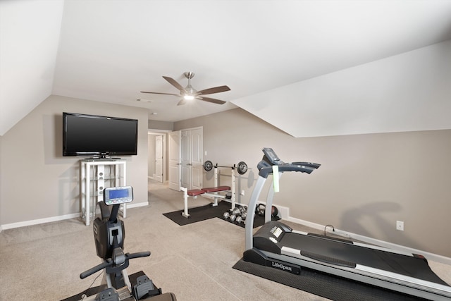 exercise room featuring ceiling fan, light carpet, and vaulted ceiling