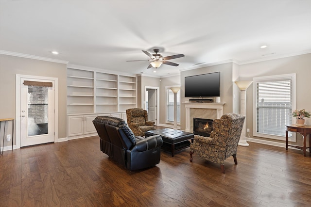 living room featuring ceiling fan, dark wood-type flooring, and ornamental molding