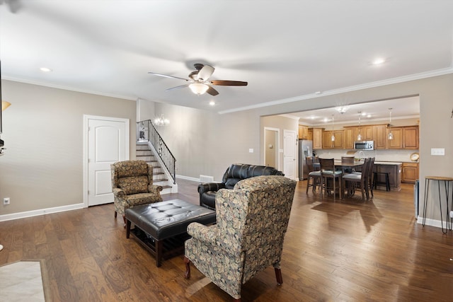 living room with ceiling fan, crown molding, and hardwood / wood-style floors