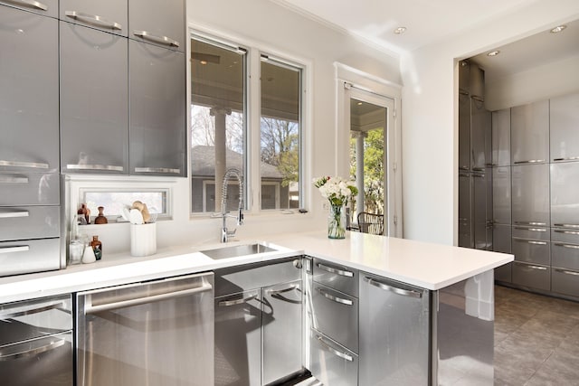 kitchen featuring tile patterned flooring, dishwasher, kitchen peninsula, sink, and gray cabinetry