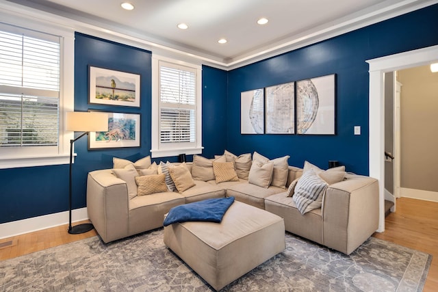 living room with hardwood / wood-style flooring and a healthy amount of sunlight