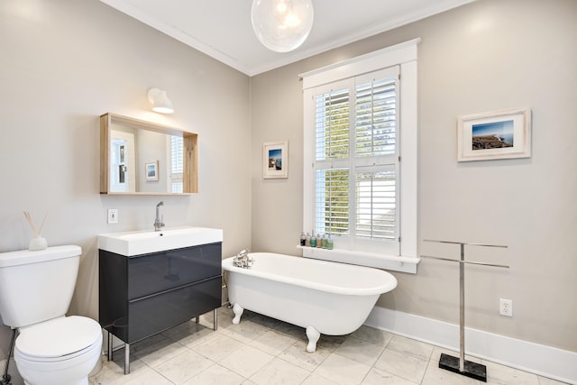 bathroom with toilet, crown molding, a tub, and vanity