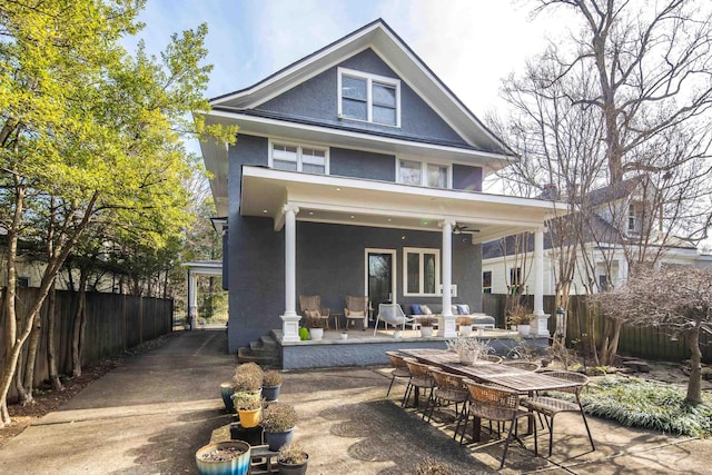 rear view of property featuring a patio area