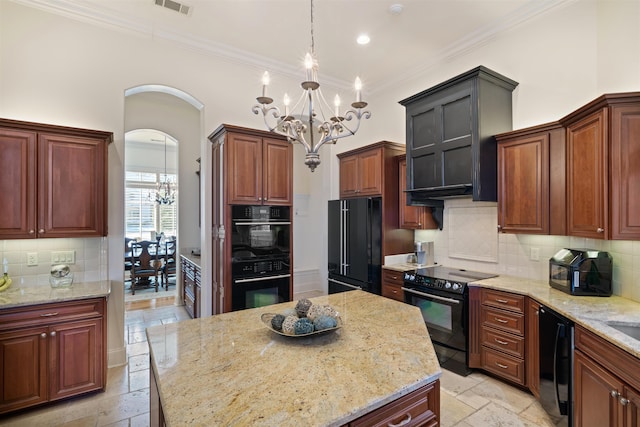 kitchen featuring a notable chandelier, pendant lighting, black appliances, decorative backsplash, and light stone countertops