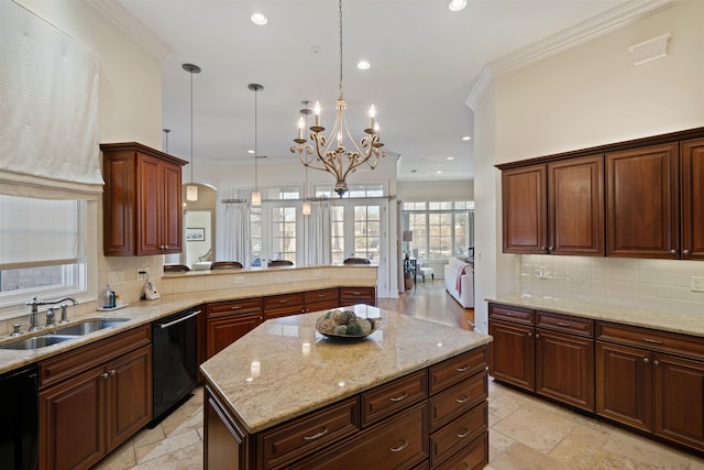 kitchen with decorative light fixtures, sink, dishwasher, and a notable chandelier