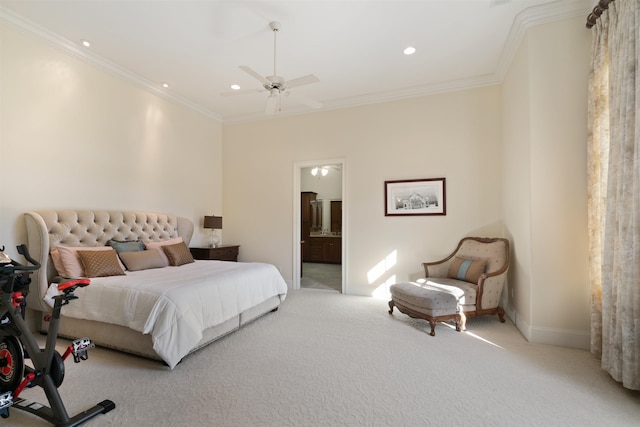 carpeted bedroom featuring ceiling fan, ensuite bathroom, and ornamental molding