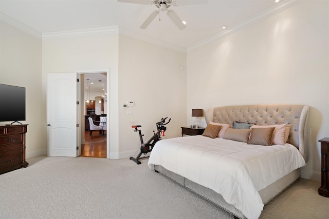 carpeted bedroom featuring ceiling fan and crown molding