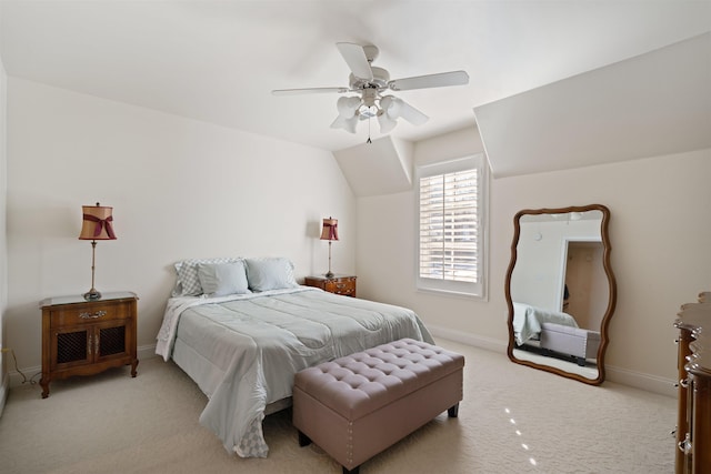 bedroom with ceiling fan, lofted ceiling, and light colored carpet