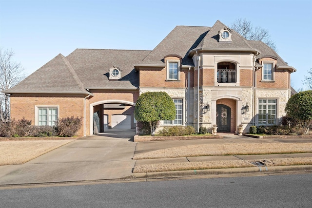 french country home featuring a garage