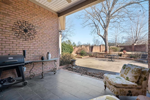 view of patio featuring ceiling fan and grilling area