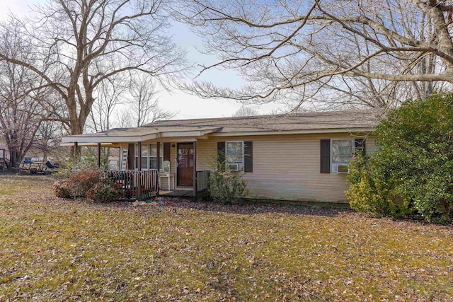 single story home with a front yard and a porch