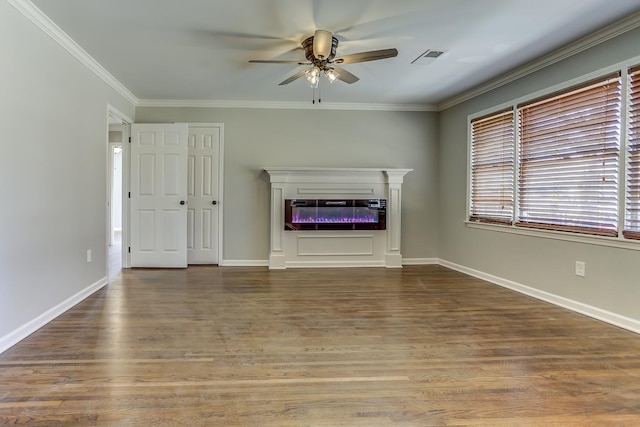 unfurnished living room with hardwood / wood-style flooring, ornamental molding, and ceiling fan