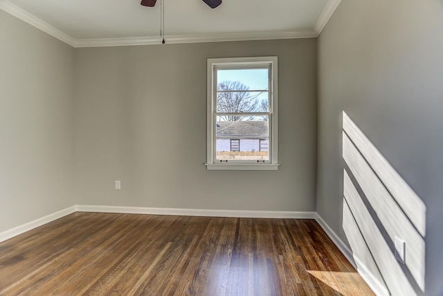 empty room featuring dark wood-type flooring, ceiling fan, and ornamental molding