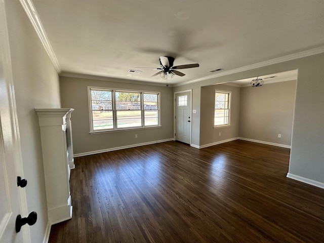 unfurnished living room featuring crown molding, plenty of natural light, and dark wood-type flooring