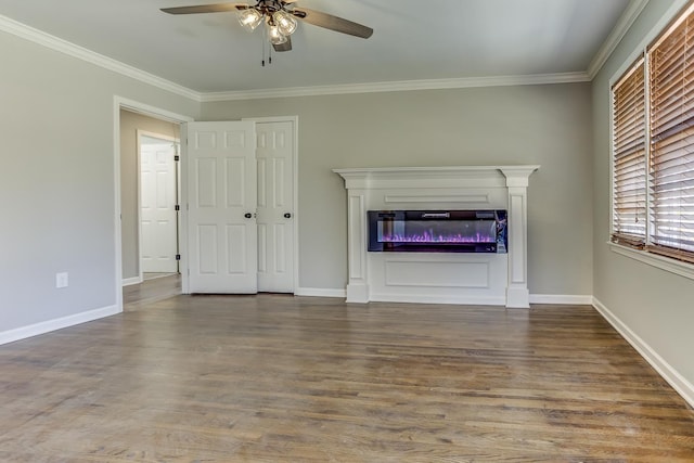 unfurnished living room featuring crown molding, ceiling fan, and dark wood-type flooring