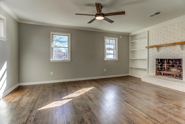 unfurnished living room featuring ceiling fan, a healthy amount of sunlight, a fireplace, and built in features