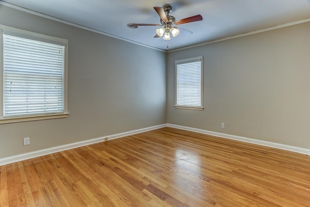 spare room featuring light hardwood / wood-style floors, ornamental molding, and ceiling fan