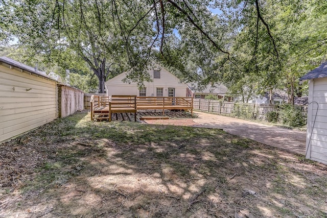 view of yard with a deck and a patio area