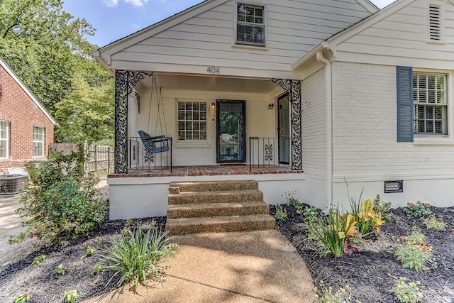 view of front of property with covered porch and central air condition unit