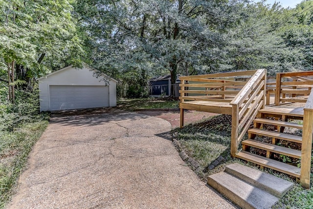 view of yard with a garage and an outdoor structure