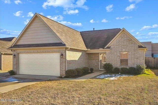 view of front of home featuring a garage and a front yard