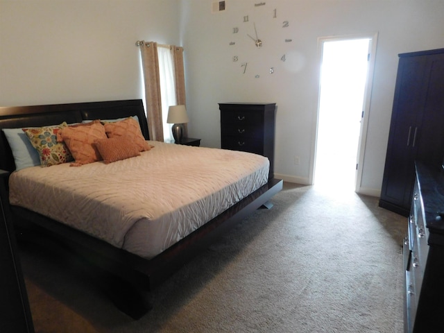 bedroom featuring baseboards and carpet floors