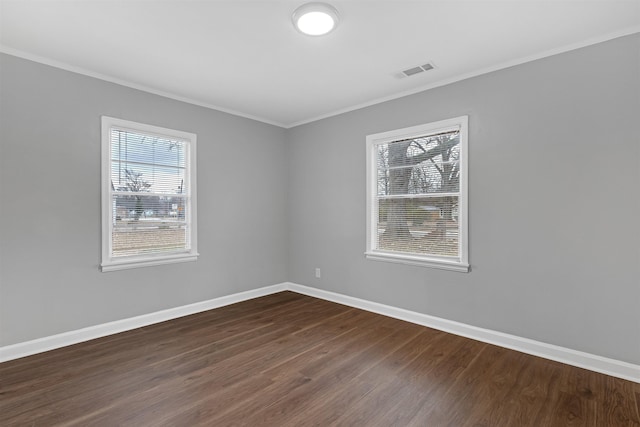 unfurnished room with dark hardwood / wood-style flooring and crown molding