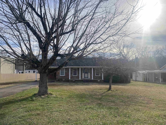 ranch-style house with a front lawn