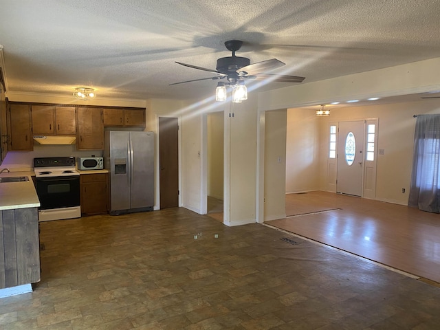 kitchen with ceiling fan, sink, and stainless steel appliances