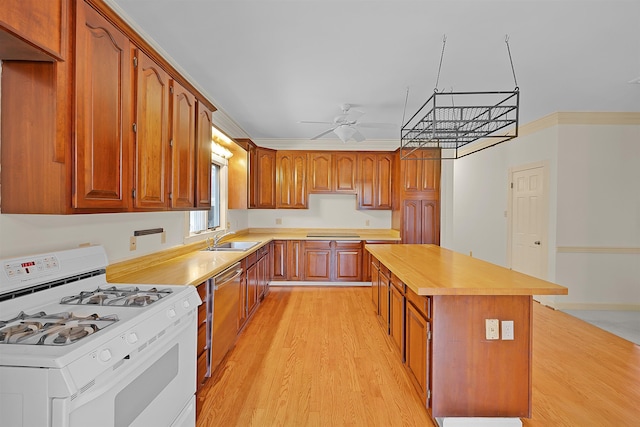 kitchen with crown molding, stainless steel dishwasher, sink, and white gas range oven