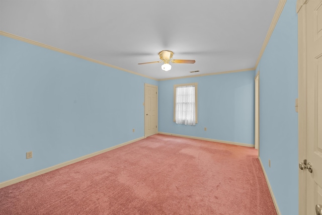 empty room with crown molding, carpet floors, and ceiling fan