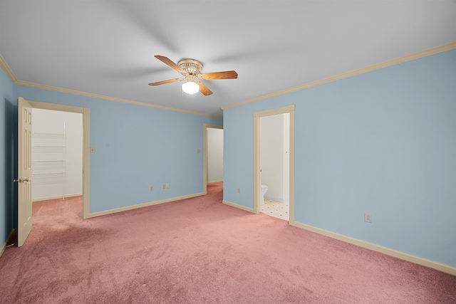 unfurnished bedroom featuring ornamental molding, light colored carpet, ceiling fan, and ensuite bathroom