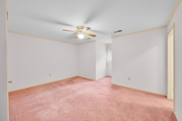 empty room featuring light carpet, crown molding, and ceiling fan