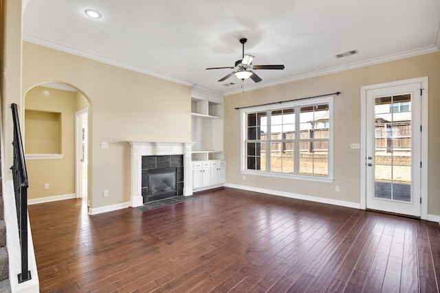 unfurnished living room with crown molding, a fireplace, baseboards, and dark wood-style flooring