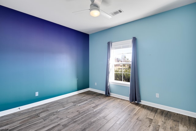 unfurnished room with ceiling fan and light hardwood / wood-style floors