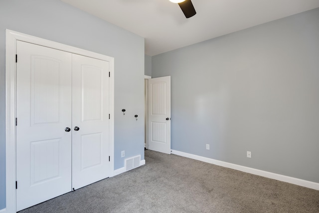 unfurnished bedroom with light carpet, a ceiling fan, visible vents, baseboards, and a closet