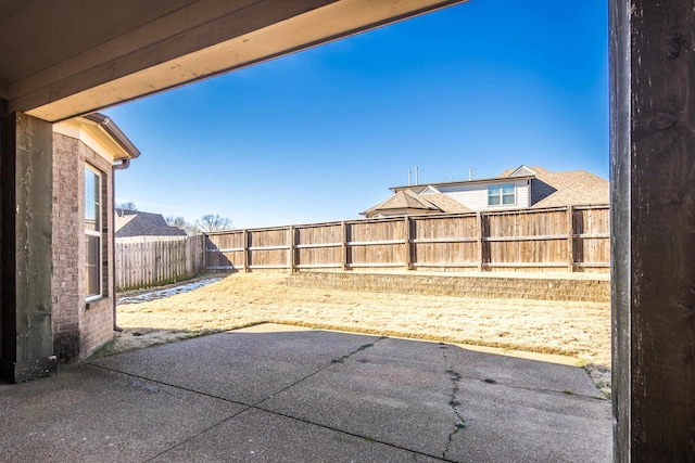 view of yard with a patio and a fenced backyard