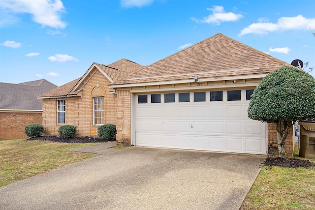 front of property featuring a garage and a front lawn