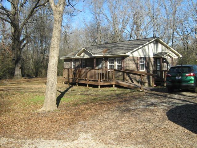 view of front of property featuring a wooden deck