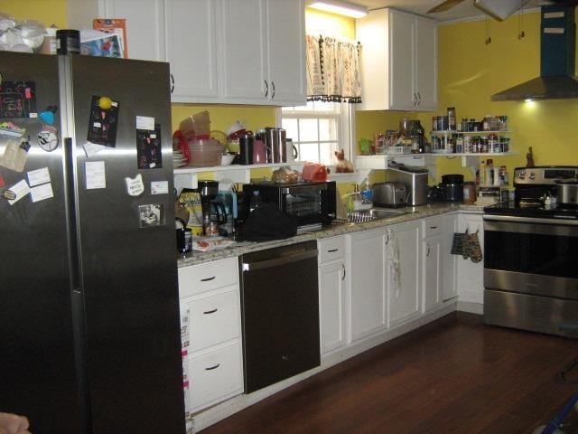 kitchen with black appliances, white cabinetry, dark wood-type flooring, wall chimney exhaust hood, and light stone counters