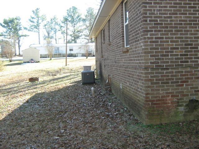 view of home's exterior featuring cooling unit