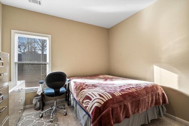 bedroom with light carpet