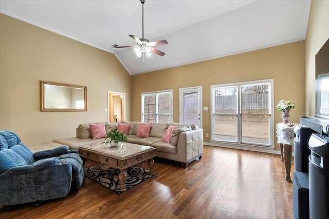 living room with hardwood / wood-style flooring, ornamental molding, lofted ceiling, and ceiling fan