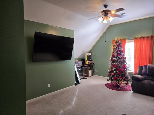 carpeted living room featuring ceiling fan and lofted ceiling