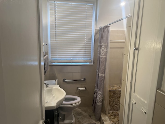 bathroom featuring walk in shower, vanity, and toilet